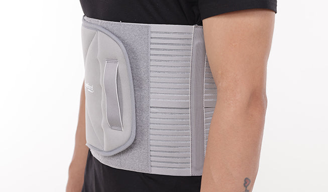 man wear a gray abdominal belt