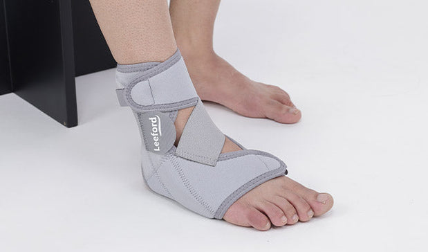 a gray ankle pain relief belt with leeford branding on it