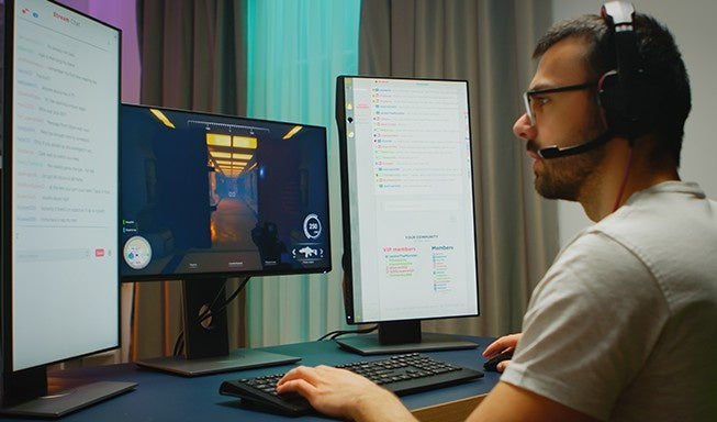 a man playing game as a gamer on his desktop pc