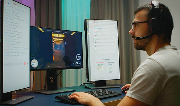 a man playing game as a gamer on his desktop pc