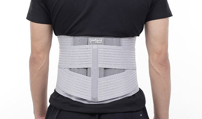 man wear gray lumbo sacral belt for pain relief