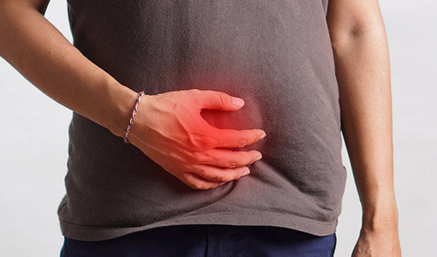 person hold his below abdomen area showing pain