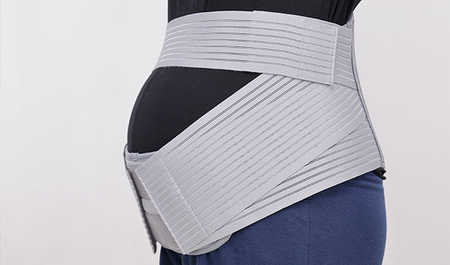 woman wear pregnancy back support