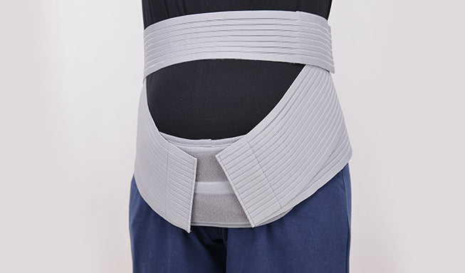 woman wearing pregnancy back support
