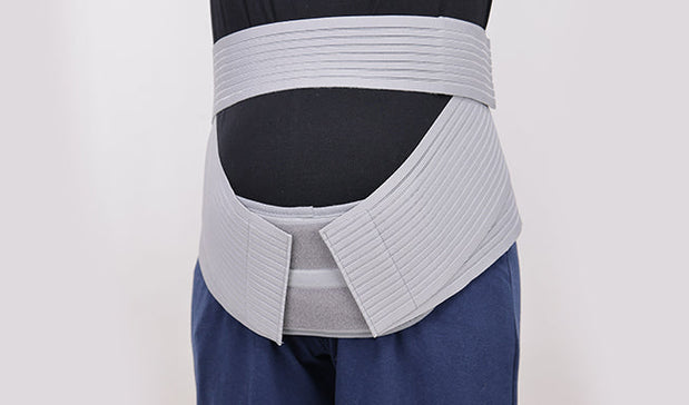 woman wearing pregnancy back support