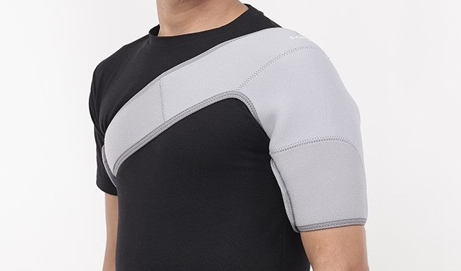 man wear gray shoulder support belt with leeford branding