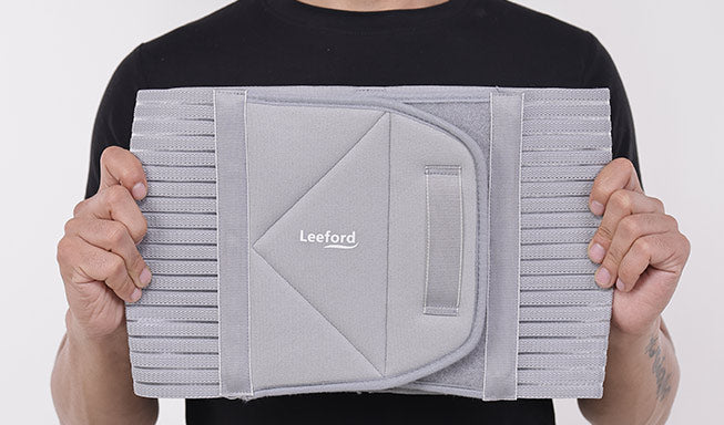 man showing Gray Abdominal Belt with Leeford branding
