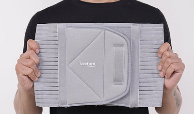 man showing Gray Abdominal Belt with Leeford branding