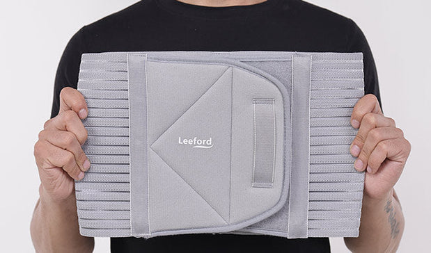 man showing Gray Abdominal Belt with Leeford branding