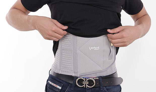 man wear a gray abdominal belt