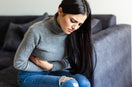 woman suffering with Acute Abdominal Pain