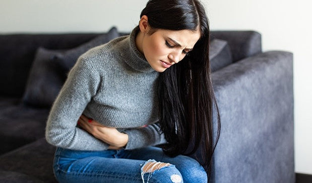 woman suffering with Acute Abdominal Pain