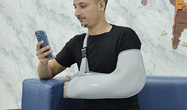 man using gray arm support