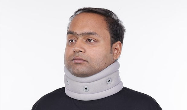 a man with neck belt