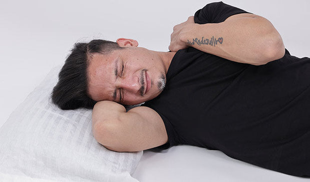 person in the sleeping postion struglling with the neck pain