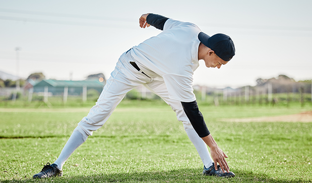 cricketer wear elbow support and doing exercise