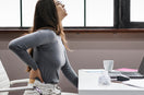 woman suffering from desk job back pain