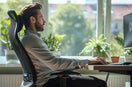 man with ergonomic sitting support