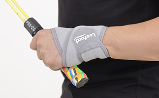 Man wear a gray wrist brace with leeford branding on it