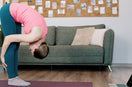 woman doing back stretches exercise at home