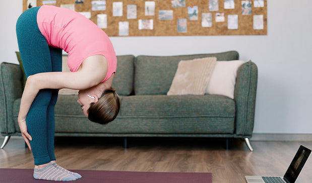 woman doing back stretches exercise at home