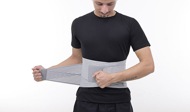 man wearing a gray back belt