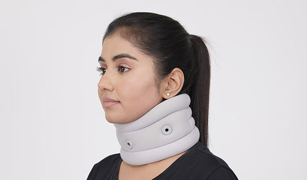 woman uses neck pain band gray 