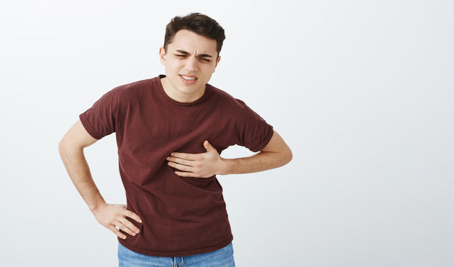 man suffering with rib pain