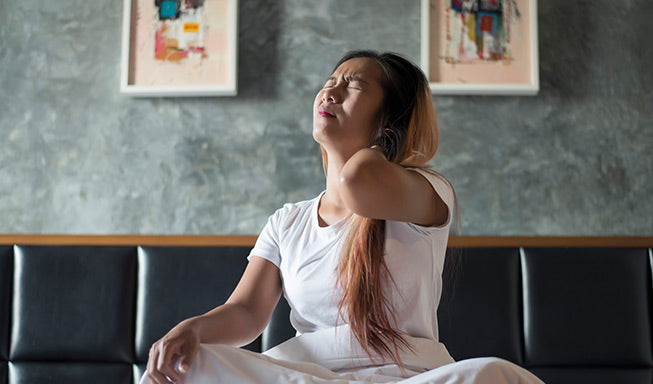 woman wake up with neck pain in morning
