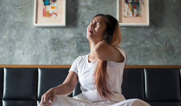 woman wake up with neck pain in morning