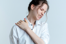 woman suffering from frozen shoulder
