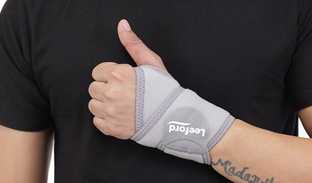 person wear a gray wrist band with leeford branding on it