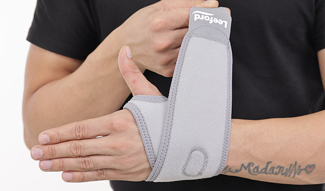 man wearing a wrist belt for pain