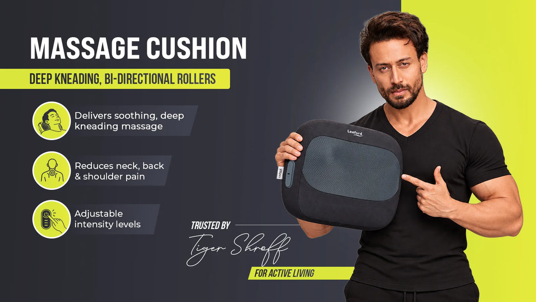 man holds a rectangular massage cushion 