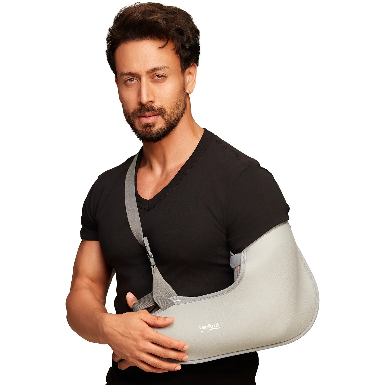 Man wearing a gray arm sling