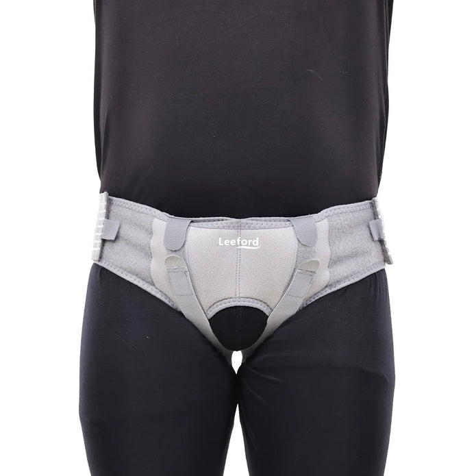 person wear a gray hernia belt
