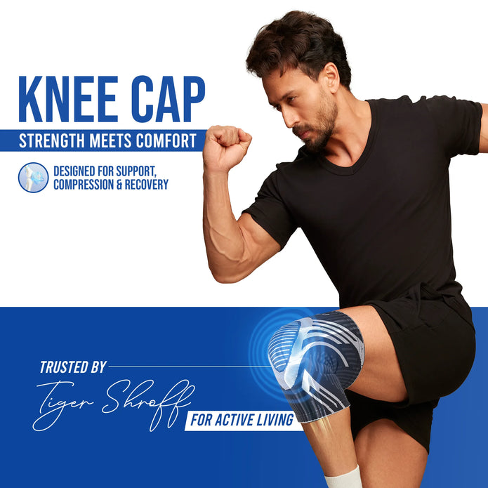 Man flexing his arm with a knee cap on promoting support compression and recovery
